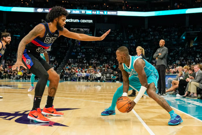 Detroit Pistons forward Marvin Bagley III defends Charlotte Hornets guard Terry Rozier.